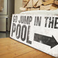 GO JUMP IN THE POOL SIGN