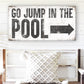 GO JUMP IN THE POOL SIGN